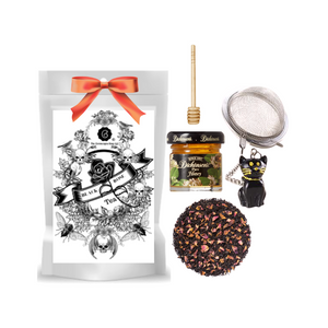 Black Rose Tea (Loose Leaf) Black Cat Tea Ball gift set Limited Edition by The Cornucopia's Tea Shop. Seasonal Halloween Label is a fun way to enjoy traditional Black Assam Tea with rose petals and a Halloween Black Cat Tea ball filter, more fun for the making. Set this Halloween Tea Package on your kitchen counter with its Black Cat tea ball, for an added seasonal flair. Gift includes: • 1 oz. Black Rose Tea (Loose Leaf) • 1- 2" Tea Ball with Black Cat, stainless steel • Dickinson's Mini Honey • Honey Spool Cornucopia's Black Rose Tea combines our full-bodied organic black tea with fragrant rose petals. • Ingredients: Organic black tea, organic rose petals and natural flavor. • Taste: Black Rose (Loose Leaf) is a full-bodied black tea brew with a floral finish. Origin: Organic black tea is sourced from family tea gardens in the Darjeeling and Assam regions of India. Gift comes in a cellophane gift bag with black raffia hand tied bow and gift card with brewing guide, 10% off next tea purchase, and your personalized gift message. Black Rose Tea (Loose Leaf) Black Cat Tea Ball gift set Limited Edition by The Cornucopia's Tea Shop. Seasonal Halloween Label is a fun way to enjoy traditional Black Assam Tea with rose petals and a Halloween Black Cat Tea ball filter, more fun for the making. Set this Halloween Tea Package on your kitchen counter with its Black Cat tea ball, for an added seasonal flair. Gift includes: • 1 oz. Black Rose Tea (Loose Leaf) • 1- 2" Tea Ball with Black Cat, stainless steel • Dickinson's Mini Honey • Honey Spool Cornucopia's Black Rose Tea combines our full-bodied organic black tea with fragrant rose petals. • Ingredients: Organic black tea, organic rose petals and natural flavor. • Taste: Black Rose (Loose Leaf) is a full-bodied black tea brew with a floral finish. Origin: Organic black tea is sourced from family tea gardens in the Darjeeling and Assam regions of India. Gift comes in a cellophane gift bag with black raffia hand tied bow and gift card with brewing guide, 10% off next tea purchase, and your personalized gift message.