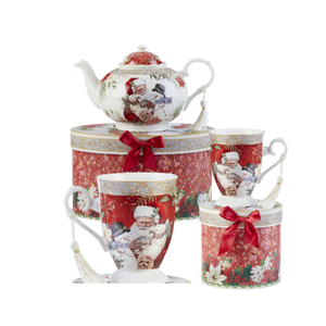 Santa Tea set, a beautiful Christmas tea set in its own matching print gift box with coordinating satin ribbon. A decorative tassel on the handle adds a lovely finishing touch. To be enjoyed throughout the holiday season, makes a lovely gift for that special tea drinker on your gift list! Add one of Cornucopia's Loose Leaf Christmas Tea blends to finnish off this special holiday gift. Includes: 9.5 x 5.6" teapot 2 Mugs, Santa Animal Friends print, in matching keepsake gift box, Soft white with a Christmas floral print background with Santa and his friends in matching keepsake gift box, Dishwasher safe Choose a Christmas Tea by the Cornucopia Shop These specialty loose leaf teas are Christmas holiday blends that are seasonal favorties in herbals and black tea base with christmas spice blends, marshmallow, pear, organge and chocolate. Robust flavors, chuncky fruites and chocolate pieces to endulge and enjoy this holiday season. Teas and Teaware are shipped together, Cornucopia Teas come in resealable pouches with decorative tea labels, and includes a recipe and brewing guide. If purchasing as a gift your personal message is included on the pamphlet. Enclosed Gift Card Sample - Standard Cover and coupon with your personalized gift message. 200 characters max. Santa Tea set, a beautiful Christmas tea set in its own matching print gift box with coordinating satin ribbon. A decorative tassel on the handle adds a lovely finishing touch. To be enjoyed throughout the holiday season, makes a lovely gift for that special tea drinker on your gift list! Add one of Cornucopia's Loose Leaf Christmas Tea blends to finnish off this special holiday gift. Includes: 9.5 x 5.6" teapot 2 Mugs, Santa Animal Friends print, in matching keepsake gift box, Soft white with a Christmas floral print background with Santa and his friends in matching keepsake gift box, Dishwasher safe Choose a Christmas Tea by the Cornucopia Shop These specialty loose leaf teas are Christmas holiday blends that are seasonal favorties in herbals and black tea base with christmas spice blends, marshmallow, pear, organge and chocolate. Robust flavors, chuncky fruites and chocolate pieces to endulge and enjoy this holiday season. Teas and Teaware are shipped together, Cornucopia Teas come in resealable pouches with decorative tea labels, and includes a recipe and brewing guide. If purchasing as a gift your personal message is included on the pamphlet. Enclosed Gift Card Sample - Standard Cover and coupon with your personalized gift message. 200 characters max.