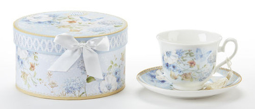 Blue Butterfly Cup/Saucer in gift box, will brighten anyone's day in its own matching print gift box with matching satin ribbon. A decorative tassel on the handle adds a lovely finishing touch. Gifting Idea: birthday gift, bridal shower, get well, treat yourself or someone you love.   Includes:  3.5" Cup/Saucer in gift box Soft white background with a Blue Hydrangea and pastel floral print Dishwasher safe  Other Items Available:  Matching Teapot available D8141-2  Tea choices available to add to your order in the loose-leaf shop   Teas and Teaware are shipped together, Cornucopia Teas come in resealable pouches with decorative tea labels, and includes a recipe and brewing guide. If purchasing as a gift your personal message is included on the pamphlet.