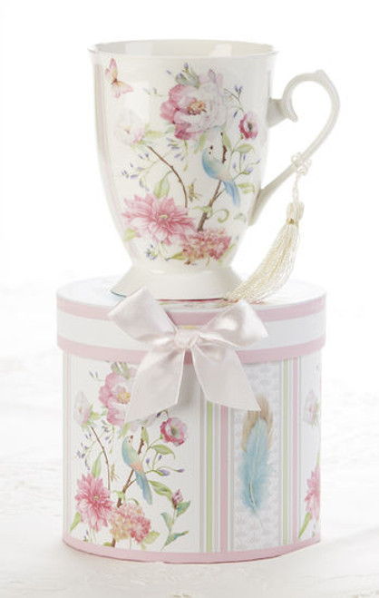 Feather and Floral Mug in gift box, will brighten anyone's day in its own matching print gift box with matching satin ribbon. A decorative tassel on the handle adds a lovely finishing touch. Gifting Idea: birthday gift, bridal shower, get well, treat yourself or someone you love.   Includes:  4.9" Mug in gift box Soft white background with a Feather and Floral print Dishwasher safe  Other Items Available:  Tea choices available to add to your order in the loose-leaf shop  Teas and Teaware are shipped together, Cornucopia Teas come in resealable pouches with decorative tea labels, and includes a recipe and brewing guide. If purchasing as a gift your personal message is included on the pamphlet.