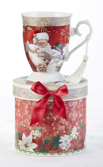 Santa Mug in gift box, will brighten this holiday season in its own matching print gift box with matching satin ribbon. A decorative tassel on the handle adds a lovely finishing touch.    Includes:  4.9" Mug in gift box Soft white background with a floral Christmas print Dishwasher safe  Other Items Available:  Tea choices available to add to your order in the loose-leaf shop  Teas and Teaware are shipped together, Cornucopia Teas come in resealable pouches with decorative tea labels, and includes a recipe and brewing guide. If purchasing as a gift your personal message is included on the pamphlet.