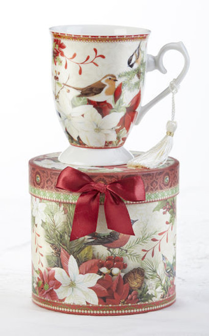 Christmas Bird Mug in gift box, will brighten this holiday season in its own matching print gift box with matching satin ribbon. A decorative tassel on the handle adds a lovely finishing touch.    Includes:  4.9" Mug in gift box Christmas red background with a floral and Christmas bird print Dishwasher safe  Other Items Available:  Tea choices available to add to your order in the loose-leaf shop  Teas and Teaware are shipped together, Cornucopia Teas come in resealable pouches with decorative tea labels, and includes a recipe and brewing guide. If purchasing as a gift your personal message is included on the pamphlet.