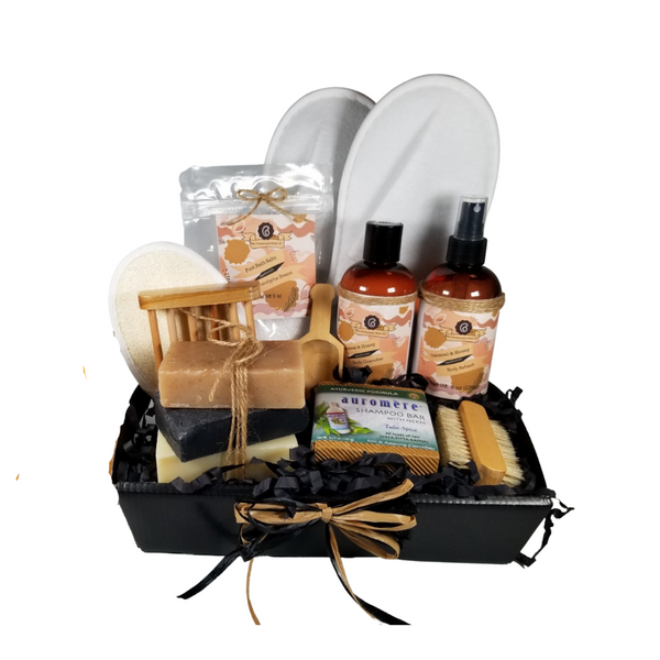 Men’s Oatmeal & Honey Spa - Gift Basket Tray by The Cornucopia Shop LLC:  a luxury spa gift just for him.  Our line includes Hand Crafted Cold Process Soaps in complimentary scents, Body Quenchers to soften skin, and Body Refresher Sprays, to use anytime for a cooling mist with a light scent he'll love. 8 ounces of foot soak to ease, sooth and refresh tired feet. Can also be used in the tub for an overall body rejuvenation.  This gift also includes a natural fiber nail brush, a bamboo and wood soap saver tray, and wood scoop for the perfect measure of foot soak. A one size fits most spa slipper he can slip into after enjoying his soak.      Includes:  •	1- 8 oz Oatmeal & Honey Body Quencher Lotion •	1- 8 oz Oatmeal & Honey Body Refresh Spray •	1- 8 oz Eucalyptus Breeze Foot Soak, no dyes,  •	1- Wooden Bath Salt Scoop  •	1- Natural double bristle sided Nail Brush by Ecolather •	1- Natural Soap Saver Bamboo and Wood Tray by Ecolather •	1- Loofah & Terry Cloth reversible Wash Pad with Wrist Band •	1- Spa Slipper, White, one sizes fits most •	1- Shampoo Bar with Neem, Ayurvedic formula by Auromere (Vata-Pitta-Kapha) •	3 Cold Process Bar Soaps, o	Oatmeal Spice (Delightful, sweet oatmeal with a robust base note.) o	Black Soap (Oakmoss and aloe top notes with light floral undertones. Contains activated charcoal) o	Bay Rum (Cloves, cinnamon, patchouli, pine, musk and vanilla with top notes of orange and apple.) Gift comes shrink wrapped in reusable gift storage tray paper shred fill, hand tied bow, and enclosure gift card with your personal message. Key Ingredients: Foot Soak: Foot Soak: Epsom Salts, Pink Himalayan Salt, Dead Sea Salt, Eucalyptus Essential Oil, Spearmint Essential Oil, Benzyl Benzoate, Benzyl Salicylate, Limonene, Linalool. White Tea and Orchid Essential Oil. All natural no dyes. Body Quencher Lotion: Water, Blend of (Coconut Oil, Hempseed Oil, Sunflower Oil, Vitamin E, Mineral Oil), Propylene Glycol, Stearic Acid, Cetyl Alcohol, Phenoxyethanol, Ethylhexylglycerin, Glyceryl Stearate, Petrolatum, TEA 99%, Proprietary Fragrance and Essential Oil Blend, Dimethicone, Carbopol, Disodium EDTA, Allantoin, Aloe Vera Gel.  Body Refresh Spray: Water, Ploysorbate 20, Fragrance,,DMDM Hydntoin, Disodium EDTA Cold Process Soaps: Olive Oil, Soybean Oil, Coconut Oil, Corn Oil. Sunflower Oil, Organic Shea Butter, Water. Sodium Hydroxide (Lye), Fragrance INCI: Olea Europaea (Olive) Oil, Glycine Soja (Soybean) Oil, Cocos Nucifera (Coconut) Oil, Zea Mays (Corn) Oil, Helianthus Annuus (Sunflower) Seed Oil, Butyrospermum Parkii (Shea Butter), Aqua, Sodium Hydroxide, Fragrance. May contain charcoal, FD&C color. Please note, that due to the handmade nature of this soap, color shades and swirl styles may slightly vary. Each loaf and bar is unique!