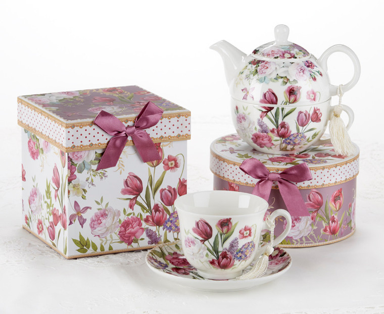 Tulip Tea for one set in gift box, will brighten anyone's day with this beautiful tea for one gift set in its own matching print gift box with matching satin ribbon. A decorative tassel on the handle adds a lovely touch. Gifting Idea: birthday gift, bridal shower, get well, thank you or treat yourself. Holds enough for a refill without leaving your comfy spot, desk or sip at beside for an evening nightcap.   Includes:  5.8" Tea for One Set in gift box Stacked teapot and oversized teacup Soft white background with a Tulip floral print Dishwasher safe  Other Items Available:  Tea choices available to add to your order in the loose-leaf shop   Teas and Teaware are shipped together, Cornucopia Teas come in resealable pouches with decorative tea labels, and includes a recipe and brewing guide. If purchasing as a gift your personal message is included on the gift card  -  Cup and saucer not included.