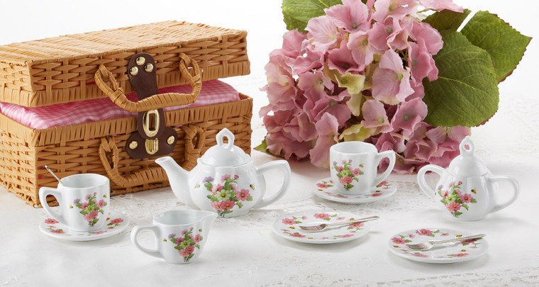 Toy Porcelain Tea Set in Basket-Multi Daisy It's a tea party set for two!  Mixed daisy print tea set in a Honey Brown picnic basket chest with pink check cloth liner. Perfect activity set for any little girl. By Delton ages 8+ •	1-Teapot, •	2-Cup and Saucer, •	2-Serving plates, •	2 each, Spoon and Fork, •	1-Storage Picnic basket. This set is part of the Cornucopia's Toy Tea party set and comes with additional add ons: •	Perfect tea party companion doll by Apple Dumplin Dolls •	1 oz (12 tea parties or more) Children's Tea available  o	There is hardly another fruit on this planet which is as popular among young and old as the strawberry. We are, therefore, presenting our decaffeinated flavored green tea variation. Its mild and, at the same time, intense taste is due to a natural strawberry flavoring, which shines when interacting with the soft tea basis. Ingredients: decaffeinated green tea, freeze-dried strawberry pieces, natural flavoring type strawberry. •	All choices are shipped together in one box. •	Gift card enclosure