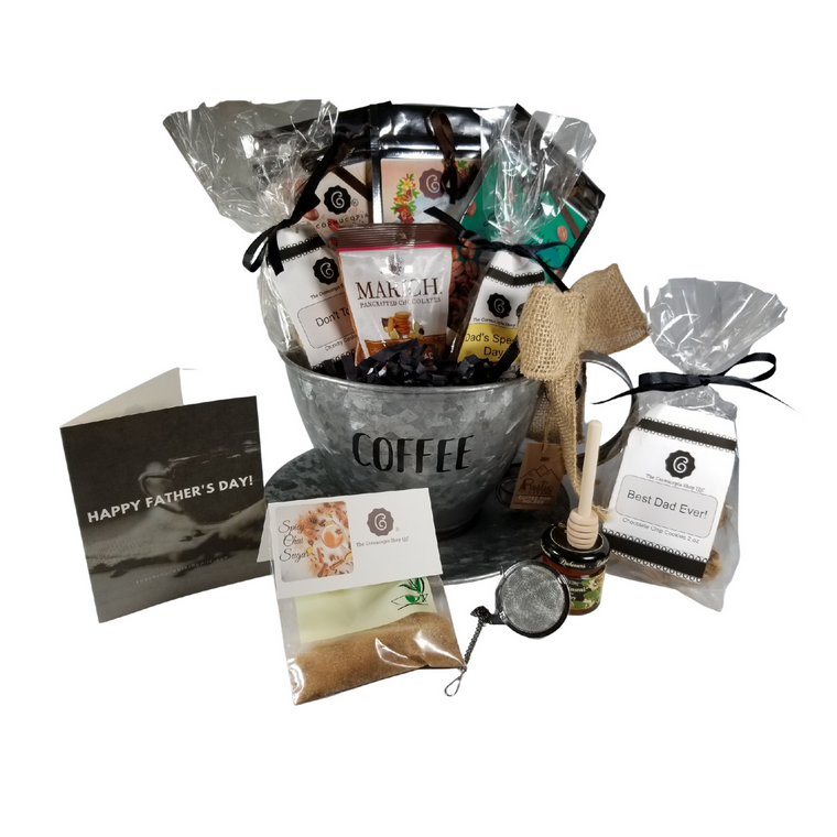 Father's Day Gourmet Coffee & Tea - Pod Holder Gift Basket: A perfect gift for Dad. This Coffee Pod holder holds up to 24 coffee pods after these goodies are gone. Filled with a selection of Cornucopia's Gourmet Coffee beans, Decaffeinated Gourmet Coffee Beans, and Cafe Latte Tea which is a mix of coffee beans, black tea, and chocolate! The rich decoration of creamy yoghurt pieces, a hint of cocoa, delicious, sweet chocolate, and coffee beans from our own roaster, all support the taste variety of this exquisite and unique mixture! Spicy Chai Sugar, use in tea or coffee, tea accessories for loose leaf tea making, and a selection of complimentary goodies to go with either brew they choose. Includes: •	Coffee Pod Counter Container - metal container shaped like a coffee cup with the word COFFEE on the front.  •	1 oz. Cornucopia's Gourmet whole coffee beans, rich full roast,  •	1 oz Cornucopia's Gourmet Decaffeinated whole coffee beans, •	1 oz of Cornucopia Shop's Organic Loose-Leaf tea 8T22441 Cafe Latte,  o	Black tea (74 %), broken cocoa bits, brittle pieces (sugar, hazelnuts, invert sugar), Jumbo chocolate chips (sugar, ground cocoa beans with cocoa butter, cocoa powder, emulsifier: Soja lecithin), flavoring, coffee beans, freeze-dried yoghurt granules (skimmed milk yogurt, sugar, maltodextrin, modified starch, acidifying agent: citric acid) •	1 oz Spicy Chai Sugar, •	Tea ball infuser 1 1/2 " stainless steel by Chai Cult made in Germany SKU 41519, •	Mini Honey 1 oz, •	Wood Honey Spool, •	1.76 oz Marich Ginger Bites, •	1.4 oz Dad's Special Day! Spiced Sugar Cookie Bites •	2 oz Best Dad Ever! Chocolate Chip Cookie Bites. Gift is wrapped in cellophane and tied with handmade bow. Father's Day Enclosure card with 10% off coupon on purchase of tea, and your personal gift message.