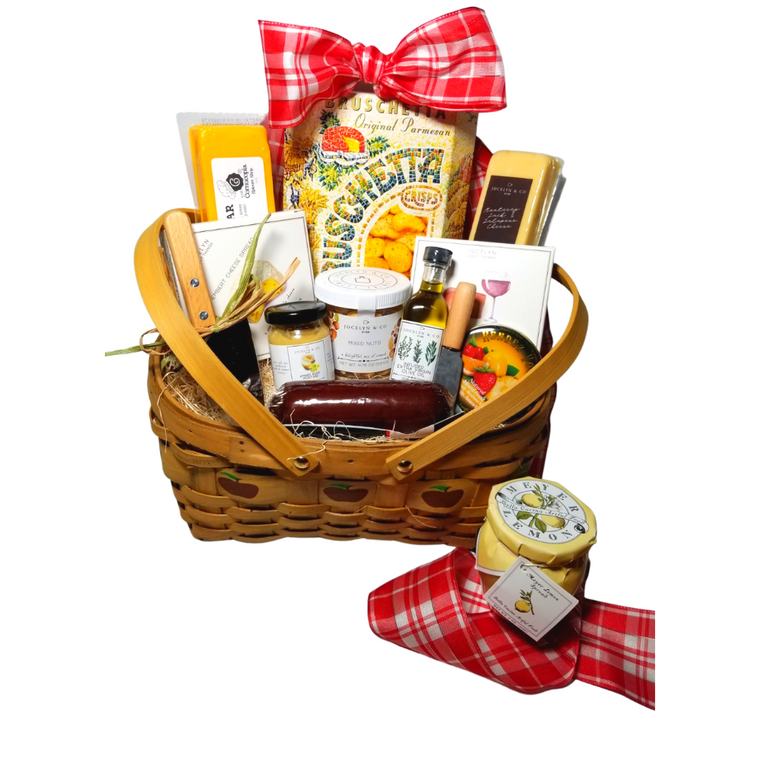 Gourmet Bounty Apple Gift Basket: a showcase of gourmet specialties and gifts ideal for a grand impression appropriate for any occasion.   Includes:  •	5” Wood Slat Apple print basket with drop handles •	Mini Cheese Spreader, •	Stainless Steel Cleaver, •	*60 ml Tuscan Extra Virgin Olive Oil, infused with rosemary, oregano, and basil. A perfect accompaniment for a cheese board •	*2 oz Gourmet Amber Beer Mustard, •	*5 oz Hardwood Smoked Summer Sausage, •	*4 oz Cheddar Cheese bar, •	*4 oz Jalapeno Monterey Jack Cheese bar, •	75 oz Mixed Nuts, delightful mix of crunch, •	*3.75 oz Cabernet Sauvignon Cheddar Cheese Spread- replaced with 8 oz bagged brownie bites, •	*3.75 oz Camembert Cheese Spread, white cheddar -replaced with 8 oz bagged peanut butter pretzels, •	5 oz Rendezvous Tin of assorted fruit hard candy drops-replaced with hard French candies •	 8 oz Candied Apple Cookie Crisps, •	6 oz Bella Cucina Meyer Lemon Spread-replaced with apple butter spread.  *Gourmet Food products are made in the USA and are shelf stable. Gift comes wrapped in cellophane with hand tied bow, a complimentary enclosure card with your personal message