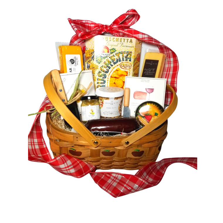Gracious Bounty Apple Gift Basket: From Cornucopia’s Epicure Shop, a showcase of gourmet specialties and gifts ideal for a grand impression appropriate for any occasion. An array of shelf-stable, cheeses, Summer Sausage, Gourmet Crackers, Mixed Nuts, (by Jocelyn & Co) & (The Cornucopia Shop) also featuring the finest Bella Cucina’s Lemon spread, a delicate light lemon spread, and Rendezvous Tin of assorted fruit flavored hard candy. Simply gourmet, simply delicious gift.   

Gift giving ideas. get well, a teacher appreciation, new home, epicurean foodie or for any other reason.

 Includes: 

5” Wood Slat Apple print basket with drop handles
Mini Cheese Spreader,
Stainless Steel Cleaver,
*2 oz Gourmet Amber Beer Mustard,
*5 oz Hardwood Smoked Summer Sausage,
*4 oz Cheddar Cheese bar 7” tall x ¾ “thick,
*4 oz Jalapeno Monterey Jack Cheese bar 7” tall x ¾ “thick,
75 oz Mixed Nuts, delightful mix of crunch,
*3.75 oz Cabernet Sauvignon Cheddar Cheese Spread, a creamy spreadable cheese made with real cabernet sauvignon wine, and cheddar cheese. Size: 4Hx4Wx1D,
*3.75 oz Camembert Cheese Spread, white cheddar and camembert cheese spread, Size: 4Hx4Wx1D,
5 oz Rendezvous Tin of assorted fruit hard candy drops
3 oz Bruschetta Parmesan Crips,

*Gourmet Food products are made in the USA and are shelf stable.

Gift comes wrapped in cellophane with hand tied Red and White Plaid bow, a complimentary enclosure card with your personal message.
