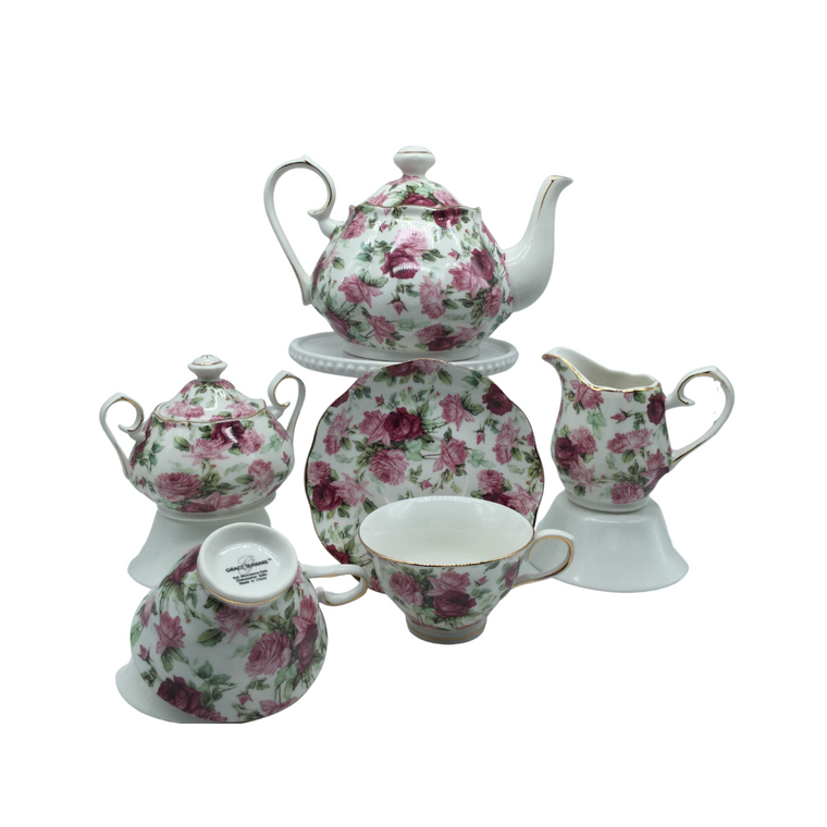 Grace Teaware Summer Rose Chintz Bouquet Tea Set Gift Boxed 11pc porcelain Grace Tea set in a Rose chintz with white background with gold trim. Beautiful and easy to incorporate into any table decor.  Complete service for 4. Teapot holds 5 cups. Matching cream and sugar bowl.  To be enjoyed for years to come.   Gifting Idea: birthday, bridal shower, or Mother's Day.  treat yourself or someone you love!   Includes:  11 pc porcelain tea set by Grace Teaware 1- 5 cup Teapot  4 - cup/saucer set 1 - Cream/sugar set White background with rose chintz print on white background, gold trim.  Dishwasher safe   Enclosure card included.