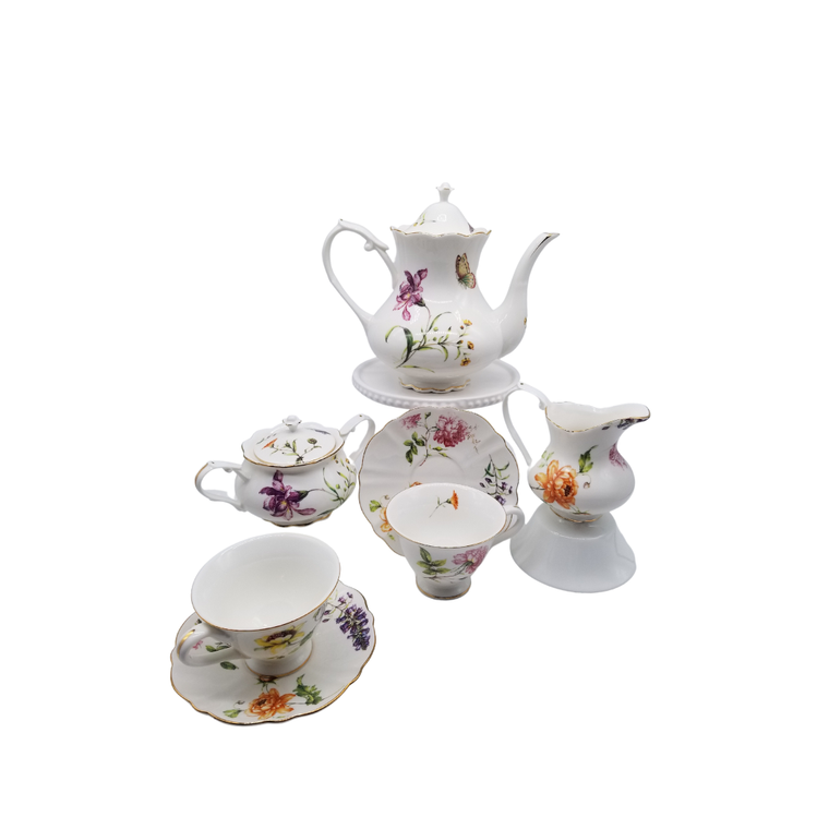 Dahlia Porcelain 11 pc Tea Set: 11pc porcelain Tea set in butterfly and floral print.  1 Teapot, 1 Set of Sugar & Creamer, and 4 Sets of Cup & Saucer.   A little sunshine for your luncheon or breakfast table.  Lovely for a ladies luncheon.  Gifting Idea: Birthday, Bridal Shower, or Mother's Day.  treat yourself or someone you love!   Includes:  11 pc porcelain tea set  1- 5 cup Teapot 4 - cup/saucer set 1- cream/sugar set Dishwasher safe   Complimentary Enclosure Card