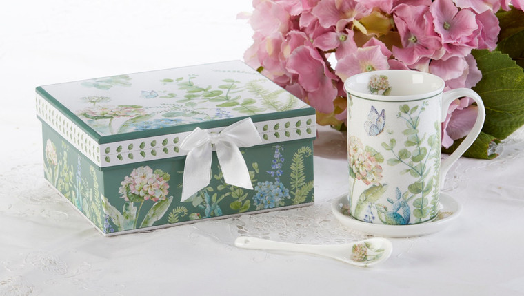 Blue Hydrangea Mug Coaster Spoon Set in Gift Box will brighten anyone's day in its own matching print gift box with matching satin ribbon. The matching coaster is perfect for any spot you leave your cup and the porcelain teaspoon makes tea time all the more special. Gifting Idea: birthday gift, bridal shower, get well, office gift, or thank you.    Includes:  4.9"  Porcelain Mug in gift box Matching Coaster  Matching Porcelain Teaspoon  Dishwasher safe