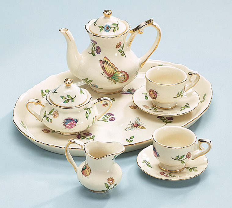 Handwash only/FDA approved.
Miniature Tea Service
Morning MeadowsPorcelain
set
1–Teapot2–Teacups & Saucers1–Creamer & Sugar Bowl1–Tray
3 3/4"H x 9"W x 7"D

FDA Approved

Arrives in a blue b + B satin lined gift box.