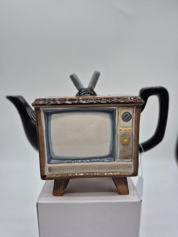 About this product



Experience the charm of Television with our TV Teapot from Blue Sky Clayworks. This unique teapot captures the essence of a Television in a practical yet playful design. Each piece is handcrafted and hand-painted, highlighting our commitment to high design and manufacturing techniques. Ideal for use, it brings a touch of nostalgia to your kitchen table, making every tea time an extraordinary experience. Size: 10inch by 5inch by 7inch. Enjoy a cup of tea with a twist of artistry!

Details



• Made in China • Weight: 2 LB