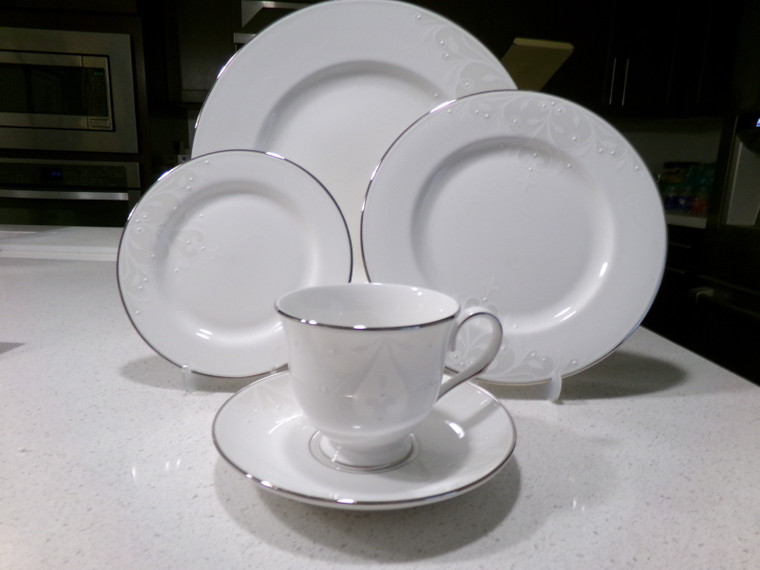 5 Piece Place Setting
Opal Innocence Scroll
by LENOX
Description: Taupe Floral Scrolls, Platinum Trim
Pattern: Opal Innocence Scroll by Lenox
Status: Discontinued. Actual: 2008 - 2020
Set Pieces
1 - Footed Cup & Saucer Set - 3 1/8 in
1 - Dinner Plate - 10 7/8 in
1 - Salad Plate - 8 1/4 in
1 - Bread & Butter Plate - 6 3/8 in