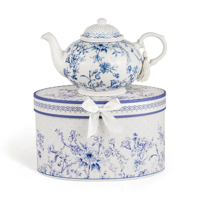 Brighten anyone's day with this beautiful tea set in its own matching print gift box with matching satin ribbon. A decorative tassel on the handle adds a lovely finishing touch. Gifting Idea: birthday gift, bridal shower, get well, treat yourself or someone you love. 

Includes:

9.5 x 5.6" Porcelain teapot, hold 4 cups (32 oz) 
2 cup/saucer
Soft white background with a English Blue Floral floral print
Dishwasher safe

Tea choices available to add to your order in the loose-leaf shop 

Teas and Teaware are shipped together,
Cornucopia Teas come in resealable pouches with decorative tea labels,
Includes a brewing guide.
If purchasing as a gift your personal message is included on the pamphlet.