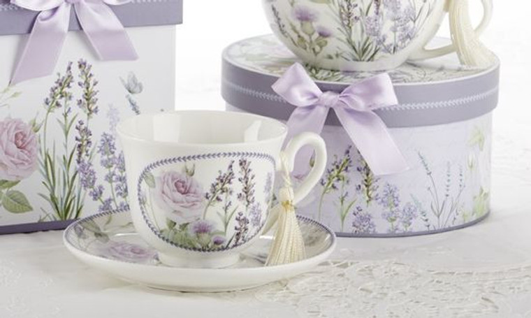 Lavender Fields Cup/Saucer in gift box, will brighten anyone's day in its own matching print gift box with matching satin ribbon. A decorative tassel on the handle adds a lovely finishing touch. Gifting Idea: birthday gift, bridal shower, get well, treat yourself or someone you love.   Includes:  3.5" Cup/Saucer in gift box Soft white background with a Lavender floral print Dishwasher safe  Other Items Available:  Matching Teapot available D8100-7 Tea choices available to add to your order in the loose-leaf shop  Teas and Teaware are shipped together, Cornucopia Teas come in resealable pouches with decorative tea labels, and includes a recipe and brewing guide. If purchasing as a gift your personal message is included on the pamphlet.