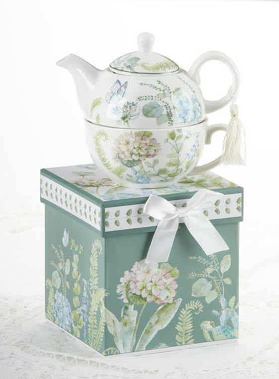 Blue Hydrangea Tea for one set in gift box, will brighten anyone's day with this beautiful tea for one gift set in its own matching print gift box with matching satin ribbon. A decorative tassel on the handle adds a lovely finishing touch. Gifting Idea: birthday gift, bridal shower, get well, thank you or treat yourself. Holds enough for a refill without leaving your comfy spot, desk or sip at beside for an evening nightcap.   Includes:  5.8" Tea for One Set in gift box Stacked teapot and oversized teacup Soft white background with a blue Hydrangea floral print Dishwasher safe  Other Items Available:  Tea choices available to add to your order in the loose-leaf shop   Teas and Teaware are shipped together, Cornucopia Teas come in resealable pouches with decorative tea labels, and includes a recipe and brewing guide. If purchasing as a gift your personal message is included on the pamphlet.