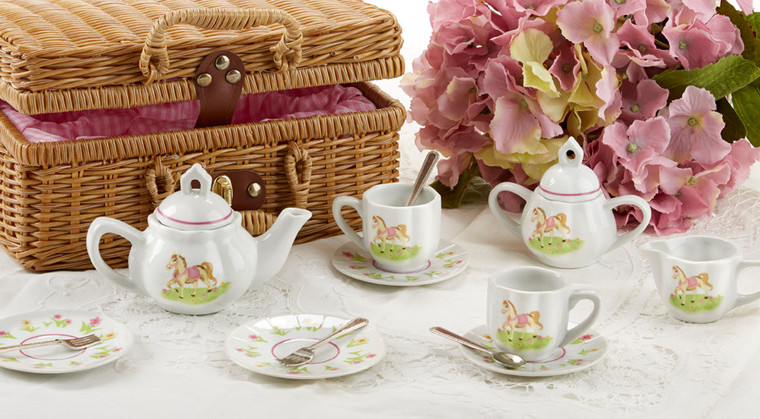 Toy Porcelain Tea Set in Basket- Pony: It's a tea party set for two!  Little Pony print tea set in a natural picnic basket chest with matching cloth liner. Perfect activity set for any little girl. By Delton ages 8+ •	1-Teapot, •	2-Cup and Saucer, •	2-Serving plates, •	2 each, Spoon and Fork, •	1-Storage Picnic basket. This set is part of the Cornucopia's Toy Tea party set and comes with additional add ons: •	Perfect tea party companion doll by Apple Dumplin Dolls •	1 oz (12 tea parties or more) Children's Tea available  o	There is hardly another fruit on this planet which is as popular among young and old as the strawberry. We are, therefore, presenting our decaffeinated, flavored green tea variation. Its mild and, at the same time, intense taste is due to a natural strawberry flavoring, which shines when interacting with the soft tea basis. Ingredients: decaffeinated green tea, freeze-dried strawberry pieces, natural flavoring type strawberry. •	All choices are shipped together in one box. •	Gift card enclosure