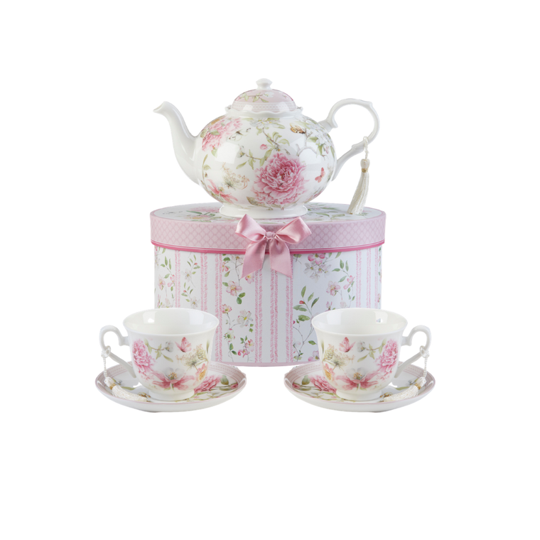 Pink Peony Tea Set, will brighten anyone's day with this beautiful tea set in its own matching print gift box with matching satin ribbon. A decorative tassel on the handle adds a lovely finishing touch. Gifting Idea: birthday gift, bridal shower, get well, treat yourself or someone you love.   Includes:  9.5 x 5.6" teapot 2 cup/saucer Soft white background with a Pink Peony floral print Dishwasher safe  Tea choices available to add to your order in the loose-leaf shop   Teas and Teaware are shipped together, Cornucopia Teas come in resealable pouches with decorative tea labels, and includes a recipe and brewing guide. If purchasing as a gift your personal message is included on the pamphlet.