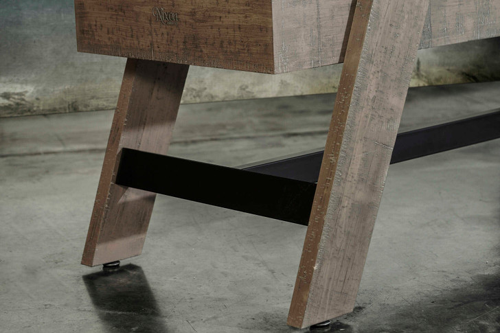 Detailed view of the tapered leg construction on the Hunter Shuffleboard Table in Antique. The finish shows subtle distressing while the steel crossbeam provides stability for consistent play.