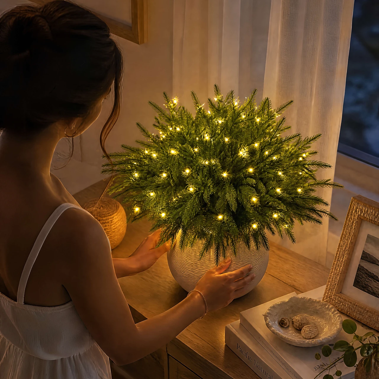 An evergreen pine arrangement styled by hand; vase not included