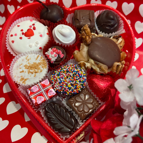 8 oz of assorted chocolates packed in a heart shaped box