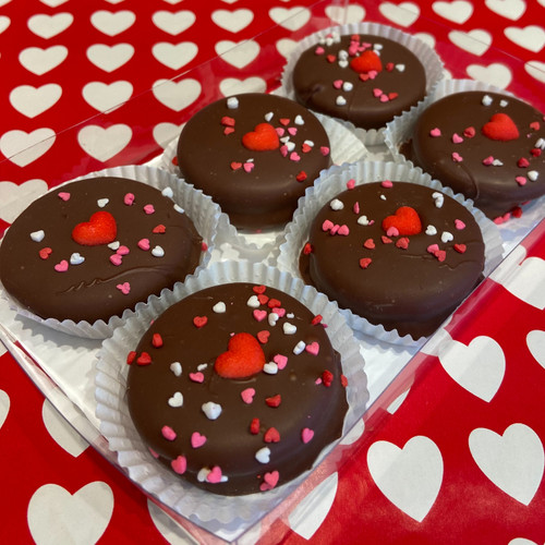 6 decorated chocolate dipped double stuffed oreos packed in a clear box