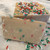 Butter flavored fudge decorated w/ Christmas sprinkles