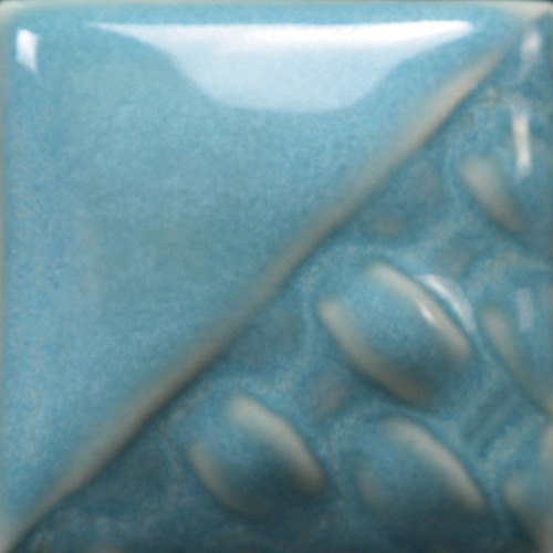 Cone 6 oxidation: Norse Blue is a semi-opaque blue gloss glaze that displays shades of light blue and green. The variation of glaze depends on application. The thicker the application, the more homogenous the color will be. The glaze will break translucent where thinner and pool darker around surface textures.

Cone 10 reduction: Color darkens.