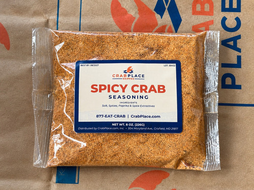 8 oz bag of Crab Place Spicy Crab Seasoning on a printed Crab Place shipping box.