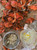 Overhead view of steamed Maryland Blue Crabs with sides of picked crab meat, lemonade, and newspaper spread.