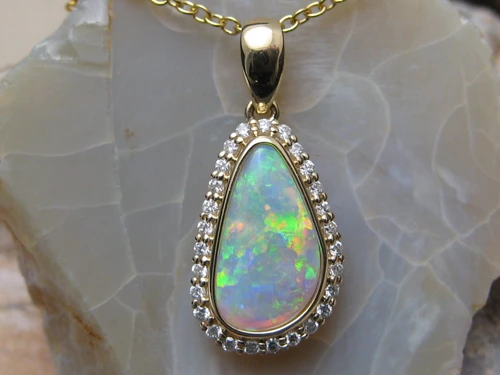 white opal diamond halo pendant
