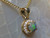 black opal diamond halo pendant
