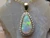 white opal diamond halo pendant