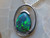 black opal and diamond pendant set in 14k white gold