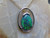 black opal and diamond pendant set in 14k white gold