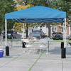 Flash Furniture Otis Portable Tailgate/Event Tent Set-10'x10' Wheeled Blue Pop Up Canopy Tent, 6-Foot Bi-Fold Table, 4 White Folding Chairs, Model# JJ-GZ10PKG183Z-4LEL3-BLWH-GG
