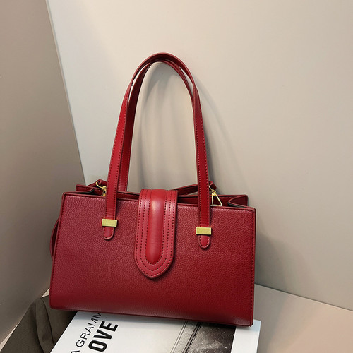 Strap-Closing Handbag