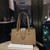 Strap-Closing Handbag