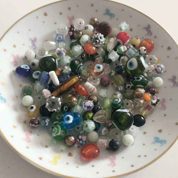 25 mixed glass beads, hand made.