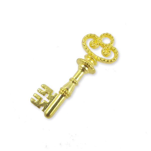 2 x ornate charms, gold colour