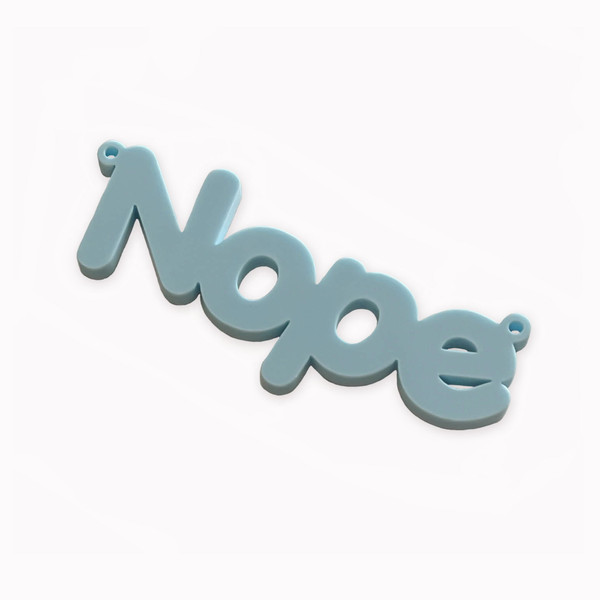 NOPE laser cut word charm
