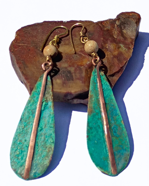 Two point five inch patina earrings.