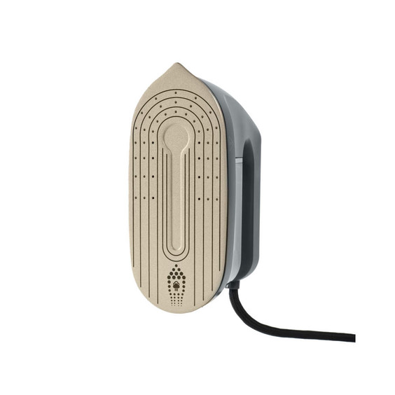 Steam iron soleplate, light gold with black cord, shown from below