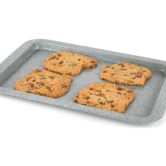 Grey baking tray with four chocolate chip cookies