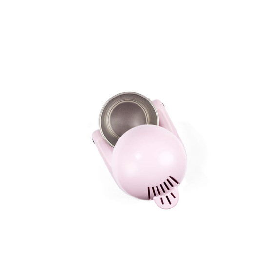 Pink mini ice cream maker from top view, showing mixing bowl.