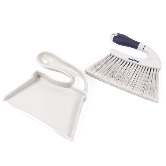 White dustpan and brush set with navy handle, shown side by side for cleaning.