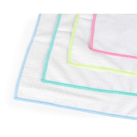 Set of white cloths with blue, green, and pink trim edges.