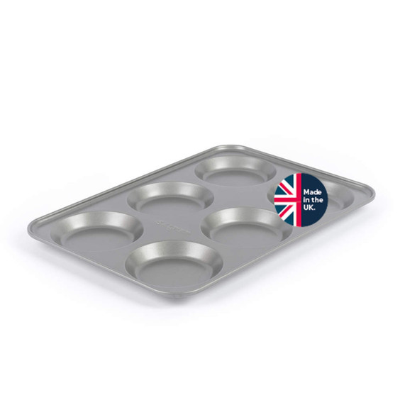 6-cup non-stick Yorkshire pudding tin, silver, angled view, badge says Made in the UK