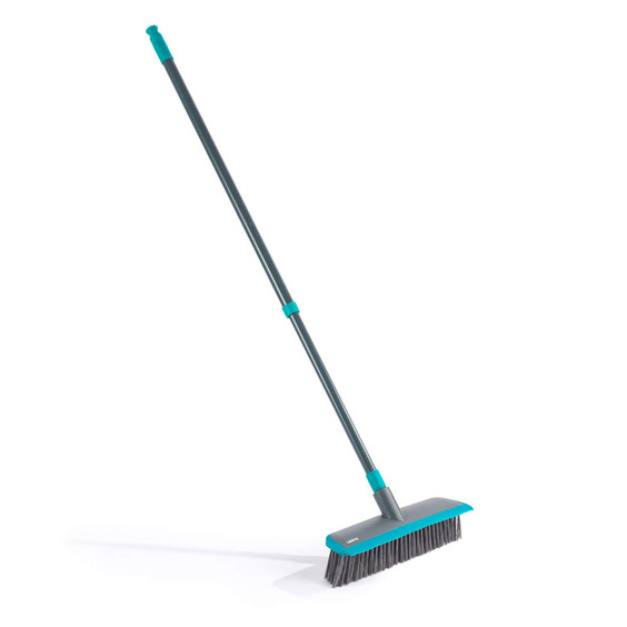 Grey indoor broom with long handle and stiff bristles, shown at side angle